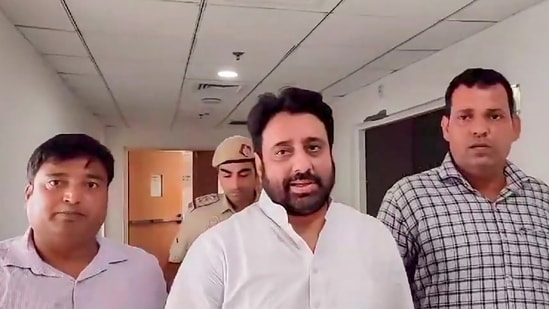 AAP MLA Amanatullah Khan being produced before a court by the Enforcement Directorate offcials in connection with a money laundering case, in New Delhi, Monday. (PTI)