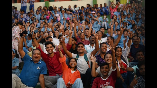 Fans enjoying the football match between East Bengal and Mohun Bagan in Lucknow on Monday. (HT)