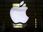 The Apple logo is illuminated at a store in the city center in Munich, Germany.