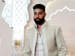 Canadian singer and rapper AP Dhillon poses for paparazzi as he attends Anant Ambani and Radhika Merchant's wedding, at Jio World Convention Centre, in Mumbai, Friday, July 12, 2024. (PTI)