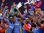 Indian team and Rahul Dravid with the T20 World Cup trophy: An image that will remain etched in hearts and minds of Indian cricket fans forever. Indian team and Rahul Dravid with the T20 World Cup trophy: An image that will remain etched in hearts and minds of Indian cricket fans forever.