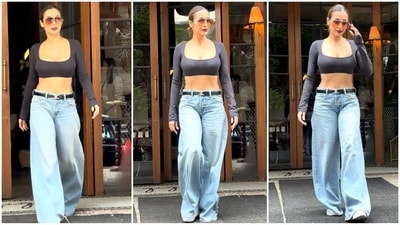 Malaika Arora's latest look is all about effortless style. She sported a black cropped top with a scoop neckline and full sleeves, perfectly paired with light blue baggy jeans. With oversized brown-tinted sunglasses, a black belt and white sneakers, she looked effortlessly stylish. (HT photo/VarinderChawla) Malaika Arora's latest look is all about effortless style. She sported a black cropped top with a scoop neckline and full sleeves, perfectly paired with light blue baggy jeans. With oversized brown-tinted sunglasses, a black belt and white sneakers, she looked effortlessly stylish. (HT photo/VarinderChawla)