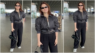 Tamannaah Bhatia's latest airport style is the epitome of trendy. She rocked a cropped black puffer jacket with folded sleeves, effortlessly paired with loose-fitting black trousers. With a chic handbag and sleek black sunglasses, she radiated laid-back vibes while still looking ultra-stylish. (HT photo/VarinderChawla) Tamannaah Bhatia's latest airport style is the epitome of trendy. She rocked a cropped black puffer jacket with folded sleeves, effortlessly paired with loose-fitting black trousers. With a chic handbag and sleek black sunglasses, she radiated laid-back vibes while still looking ultra-stylish. (HT photo/VarinderChawla)