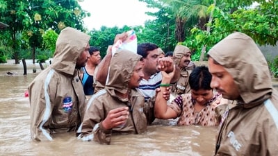 The Telangana Special Police (TGSP) personnel conduct rescue operations in the flood-affected areas. The National Disaster Response Force (NDRF) team, along with Central forces and district officials, also provided food, drinking water, and other essential items to the flood-affected areas in Vijayawada through helicopters. (ANI) The Telangana Special Police (TGSP) personnel conduct rescue operations in the flood-affected areas. The National Disaster Response Force (NDRF) team, along with Central forces and district officials, also provided food, drinking water, and other essential items to the flood-affected areas in Vijayawada through helicopters. (ANI)