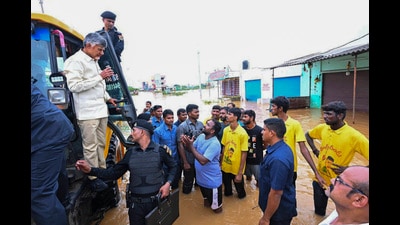Andhra Pradesh Chief Minister N Chandrababu Naidu interacts with affected people during his visit to the flood-affected areas, in Vijayawada. (PTI) Andhra Pradesh Chief Minister N Chandrababu Naidu interacts with affected people during his visit to the flood-affected areas, in Vijayawada. (PTI)