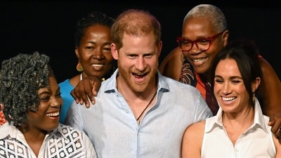 Britain's Prince Harry (C), Duke of Sussex, and his wife Meghan Markle (R) pose for a picture with Colombia's former Education Minister Aurora Vergara (L) and other participants, at the end of the "Afro women and power" forum, at the Municipal Theatre in Cali, Colombia, on August 18, 2024. (AFP) Britain's Prince Harry (C), Duke of Sussex, and his wife Meghan Markle (R) pose for a picture with Colombia's former Education Minister Aurora Vergara (L) and other participants, at the end of the "Afro women and power" forum, at the Municipal Theatre in Cali, Colombia, on August 18, 2024. (AFP)