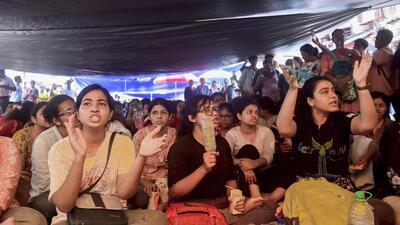 Junior doctors stage a protest on a road near Lalbazar police headquarters in Kolkata on Tuesday. (PTI) Junior doctors stage a protest on a road near Lalbazar police headquarters in Kolkata on Tuesday. (PTI)