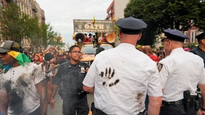 Police officers walk as revelers take part in the J'ouvert on the day of the annual West Indian American Day parade in the Brooklyn borough of New York City, U.S., September 2, 2024. REUTERS/Cheney Orr (REUTERS)