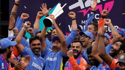 Indian team and Rahul Dravid with the T20 World Cup trophy: An image that will remain etched in hearts and minds of Indian cricket fans forever. (AP) Indian team and Rahul Dravid with the T20 World Cup trophy: An image that will remain etched in hearts and minds of Indian cricket fans forever. (AP)