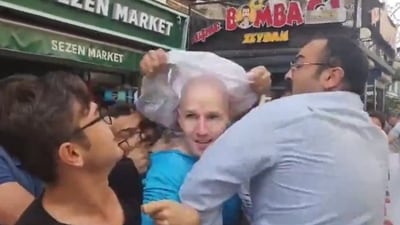 The video uploaded on social media shows US Marines dressed in civilian attire shouting for help while being attacked by a mob of anti-American men. (X) The video uploaded on social media shows US Marines dressed in civilian attire shouting for help while being attacked by a mob of anti-American men. (X)