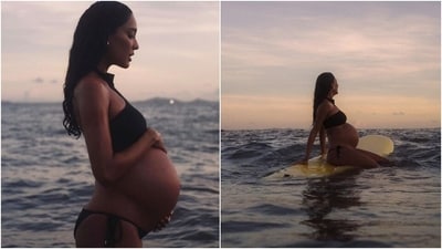 Lisa Haydon shot these pictures for a magazine cover photoshoot. With a stunning sunset and the sea in the backdrop, Lisa bared her pregnant belly in a black swimsuit. She styled the glorious look with minimal jewels, loose centre-parted hair, and glowing skin. (Instagram) Lisa Haydon shot these pictures for a magazine cover photoshoot. With a stunning sunset and the sea in the backdrop, Lisa bared her pregnant belly in a black swimsuit. She styled the glorious look with minimal jewels, loose centre-parted hair, and glowing skin. (Instagram)