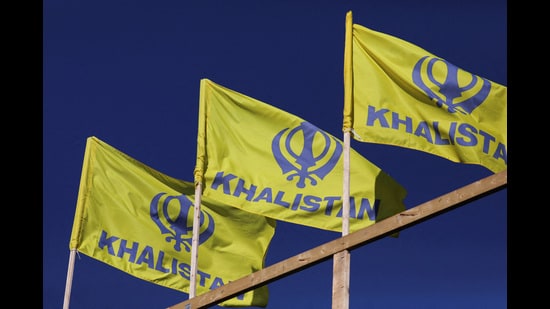 Pro-indepence Khalistan flags are seen at the Guru Nanak Sikh Gurdwara temple, site of the June 2023 killing of Sikh leader Hardeep Singh Nijjar, in Surrey, British Columbia. (REUTERS)