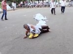 The image shows an MP man rolling with documents tied to him. The image shows an MP man rolling with documents tied to him.