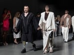 Ukrainian war veterans wearing prosthetics takes to the runway to demonstrate outfit by designers Andreas Moskin and Andriy Bilous during Fashion Week show.