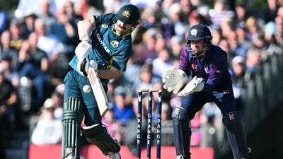 Australia's Travis Head (L) hits a six in front of Scotland's wicketkeeper Matthew Cross during the first Twenty20 International cricket match between Scotland and Australia at the Grange Cricket Club in Edinburgh (AFP) Australia's Travis Head (L) hits a six in front of Scotland's wicketkeeper Matthew Cross during the first Twenty20 International cricket match between Scotland and Australia at the Grange Cricket Club in Edinburgh (AFP)