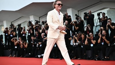 Actor Daniel Craig attended the red carpet event for the movie ‘Queer’ in an all-white ensemble. His look included a fitted blazer, matching pants, and a crisp white shirt. Complemented by black sunglasses, he exuded a dashing and stylish aura. (Photo by Marco BERTORELLO / AFP)