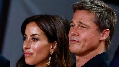 Ines de Ramon and Brad Pitt pose on the red carpet of Wolfs, during the 81st Venice Film Festival. REUTERS/Yara Nardi (REUTERS)