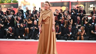 Actress Lesley Manville wowed on the red carpet in a stunning brown Loewe gown. The ensemble featured a one-shoulder design with stylish wrapping detailing at the midriff, creating a look that was both elegant and sophisticated. (Photo by Alberto PIZZOLI / AFP)