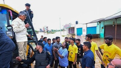 Andhra Pradesh Chief Minister N Chandrababu Naidu interacts with affected people during his visit to the flood-affected areas, in Vijayawada on Tuesday, September 3. (PTI) Andhra Pradesh Chief Minister N Chandrababu Naidu interacts with affected people during his visit to the flood-affected areas, in Vijayawada on Tuesday, September 3. (PTI)