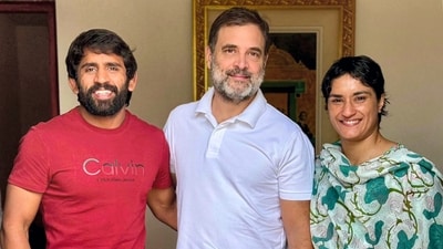 Vinesh Phogat along with Wrestler Bajrang Punia met Leader of Opposition Rahul Gandhi on Wednesday. (PTI) Vinesh Phogat along with Wrestler Bajrang Punia met Leader of Opposition Rahul Gandhi on Wednesday. (PTI)