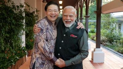 The Singapore premier’s office showed the two leaders embracing and having a chat before the dinner, for which they were joined by close aides (X/LawrenceWongST) The Singapore premier’s office showed the two leaders embracing and having a chat before the dinner, for which they were joined by close aides (X/LawrenceWongST)