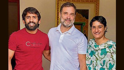 Wrestlers Vinesh Phogat (right) and Bajrang Punia meet with Rahul Gandhi in New Delhi on Wednesday. (Hindustan Times) Wrestlers Vinesh Phogat (right) and Bajrang Punia meet with Rahul Gandhi in New Delhi on Wednesday. (Hindustan Times)