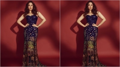 Her gown, designed by the renowned fashion designer Rahul Mishra, features an off-shoulder neckline, a glittering dark purple hue, and an enchanting multi-coloured print at the bottom, making it nothing short of a masterpiece. (Instagram/@tamannaahspeaks)