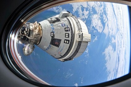 This photo provided by NASA shows Boeing's Starliner spacecraft which launched astronauts Butch Wilmore and Suni Williams to the International Space Station docked to the Harmony module's forward port on July 3, 2024, seen from a window on the SpaceX Dragon Endeavour spacecraft docked to the adjacent port. (AP) This photo provided by NASA shows Boeing's Starliner spacecraft which launched astronauts Butch Wilmore and Suni Williams to the International Space Station docked to the Harmony module's forward port on July 3, 2024, seen from a window on the SpaceX Dragon Endeavour spacecraft docked to the adjacent port. (AP)