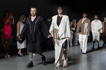 Ukrainian war veterans wearing prosthetics takes to the runway to demonstrate outfit by designers Andreas Moskin and Andriy Bilous during Fashion Week show. (AP Photo/Efrem Lukatsky) Ukrainian war veterans wearing prosthetics takes to the runway to demonstrate outfit by designers Andreas Moskin and Andriy Bilous during Fashion Week show. (AP Photo/Efrem Lukatsky)