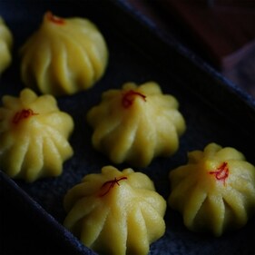 Rose and coconut stuffed modaks (unsplash) Rose and coconut stuffed modaks (unsplash)