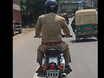 The police officer was seen violating number plate rules. 