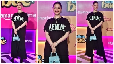 Tamannaah Bhatia nailed the cool-girl vibe in a Balenciaga top paired with stylish flared pants. She completed the trendy look with layered gold necklaces, hoop earrings, a mini blue bag, and heels, exuding effortless style. (HT Photo/VarinderChawla) Tamannaah Bhatia nailed the cool-girl vibe in a Balenciaga top paired with stylish flared pants. She completed the trendy look with layered gold necklaces, hoop earrings, a mini blue bag, and heels, exuding effortless style. (HT Photo/VarinderChawla)