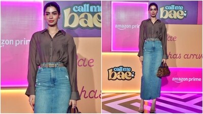 Khushi Kapoor rocked a denim skirt with a brown belt, paired with a brown netted shirt tucked in. She completed her chic look with nude pump heels, an animal print bag, and her hair styled in a sleek bun. (HT Photo/VarinderChawla) Khushi Kapoor rocked a denim skirt with a brown belt, paired with a brown netted shirt tucked in. She completed her chic look with nude pump heels, an animal print bag, and her hair styled in a sleek bun. (HT Photo/VarinderChawla)