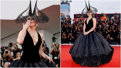 Lady Gaga dazzled at the Venice Film Festival in a voluminous Christian Dior gown paired with a vintage Philip Treacy headpiece. Lady Gaga dazzled at the Venice Film Festival in a voluminous Christian Dior gown paired with a vintage Philip Treacy headpiece.