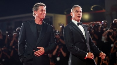 Brad Pitt and George Clooney pose on the red carpet during arrivals for the movie "Wolfs", presented out of competition, during the 81st Venice Film Festival in Venice, Italy, September 1, 2024. (REUTERS)