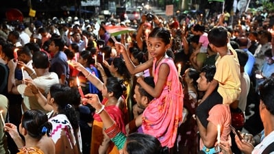 People hold candles during a demonstration on September 4, 2024, to condemn the rape and murder of a doctor at the RG Kar Medical College and Hospital in Kolkata, . (AFP) People hold candles during a demonstration on September 4, 2024, to condemn the rape and murder of a doctor at the RG Kar Medical College and Hospital in Kolkata, . (AFP)