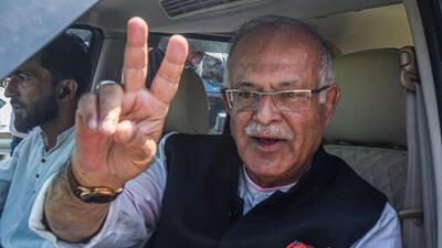 Jammu and Kashmir Congress unit chief Tariq Hameed Karra shows a victory sign after filing nomination papers from the Central Shalteng. (ANI) Jammu and Kashmir Congress unit chief Tariq Hameed Karra shows a victory sign after filing nomination papers from the Central Shalteng. (ANI)