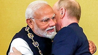 Prime Minister Narendra Modi embraces Russian President Vladimir Putin after receiving the Order of St Andrew the Apostle the First-Called, Russia's highest civilian honour, at St Catherine's Hall, in Moscow. Prime Minister Narendra Modi embraces Russian President Vladimir Putin after receiving the Order of St Andrew the Apostle the First-Called, Russia's highest civilian honour, at St Catherine's Hall, in Moscow.