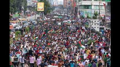 Students and other activists carry Bangladesh's national flag during a protest march organized by Students Against Discrimination to mark one month since former Prime Minister Sheikh Hasina stepped down after a mass uprising, in Dhaka, Bangladesh, Thursday, Sept. 5, 2024. AP/PTI(AP09_05_2024_000397A) (AP) Students and other activists carry Bangladesh's national flag during a protest march organized by Students Against Discrimination to mark one month since former Prime Minister Sheikh Hasina stepped down after a mass uprising, in Dhaka, Bangladesh, Thursday, Sept. 5, 2024. AP/PTI(AP09_05_2024_000397A) (AP)