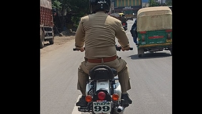 The police officer was seen violating number plate rules. The police officer was seen violating number plate rules.