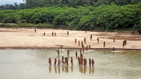 Members of the "uncontacted" Mashco Piro tribe along the Las Piedras River in Peru's Amazon. They killed two loggers using a bow and arrow. (AP)