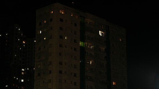 The lights of a residential building are seen turned off in response to call by junior doctors to light a diya as protest against rape and murder of female doctor in Kolkata.(PTI)