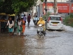 After the heavy rain on Wednesday people are crossing a waterlogged street at sector-37C near Rama Garden, in Gurugram, India, on Thursday. (Parveen Kumar/Hindustan Times) After the heavy rain on Wednesday people are crossing a waterlogged street at sector-37C near Rama Garden, in Gurugram, India, on Thursday. (Parveen Kumar/Hindustan Times)