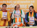 Home minister Amit Shah, MoS Jitendra Singh and Jammu and Kashmir BJP president Ravinder Raina during the release of BJP's election manifesto ahead of the state Assembly elections in Jammu on September 6. Home minister Amit Shah, MoS Jitendra Singh and Jammu and Kashmir BJP president Ravinder Raina during the release of BJP's election manifesto ahead of the state Assembly elections in Jammu on September 6.