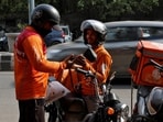 Gig workers prepare to deliver orders outside Swiggy's grocery warehouse at a market area in New Delhi, India, May 6, 2024. (Priyanshu Singh/Reuters)