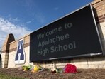 Flowers lay in front of the school sign outside of Apalachee High School on September 5, 2024 in Winder, Georgia.(Photo by Jessica McGowan / GETTY IMAGES NORTH AMERICA / Getty Images via AFP) Flowers lay in front of the school sign outside of Apalachee High School on September 5, 2024 in Winder, Georgia.(Photo by Jessica McGowan / GETTY IMAGES NORTH AMERICA / Getty Images via AFP)