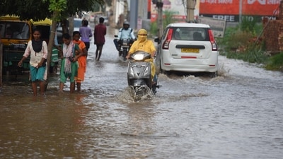 After the heavy rain on Wednesday people are crossing a waterlogged street at sector-37C near Rama Garden, in Gurugram, India, on Thursday. (Parveen Kumar/Hindustan Times) After the heavy rain on Wednesday people are crossing a waterlogged street at sector-37C near Rama Garden, in Gurugram, India, on Thursday. (Parveen Kumar/Hindustan Times)