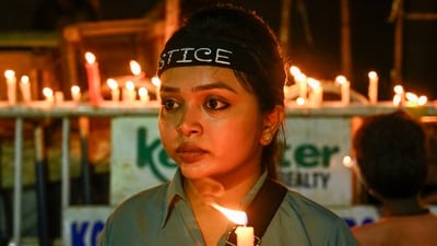 Citizens participate in a specially organised candlelight protest over alleged rape and murder of a trainee doctor outside RG Kar Medical College and Hospital in Kolkata on Wednesday night. (Samir Jana/ Hindustan Times) Citizens participate in a specially organised candlelight protest over alleged rape and murder of a trainee doctor outside RG Kar Medical College and Hospital in Kolkata on Wednesday night. (Samir Jana/ Hindustan Times)