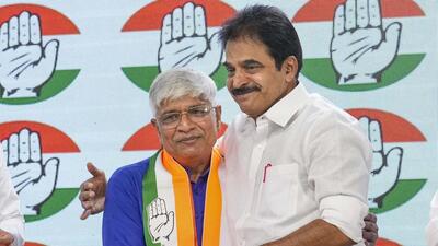 Congress leader KC Venugopal greets Rajendra Pal Gautam on Friday. (PTI) Congress leader KC Venugopal greets Rajendra Pal Gautam on Friday. (PTI)