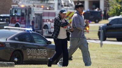 People walk as law enforcement officers work at the scene of a shooting at Apalachee High School in Winder, Georgia, U.S. September 4, 2024. REUTERS/Elijah Nouvelage (REUTERS)
